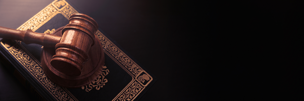 Gavel with brown background with gavel for court announcements.